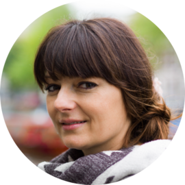 Portrait of a smiling woman. Female tourist in Amsterdam.