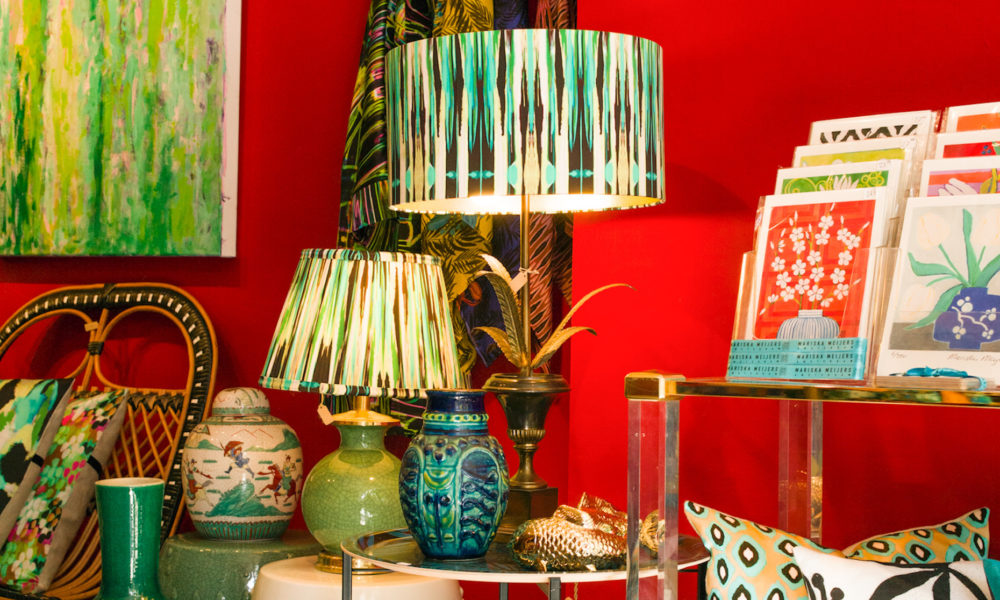 A stylish home interior with green lamps and paintings. Beautiful decoration ideas for your home.