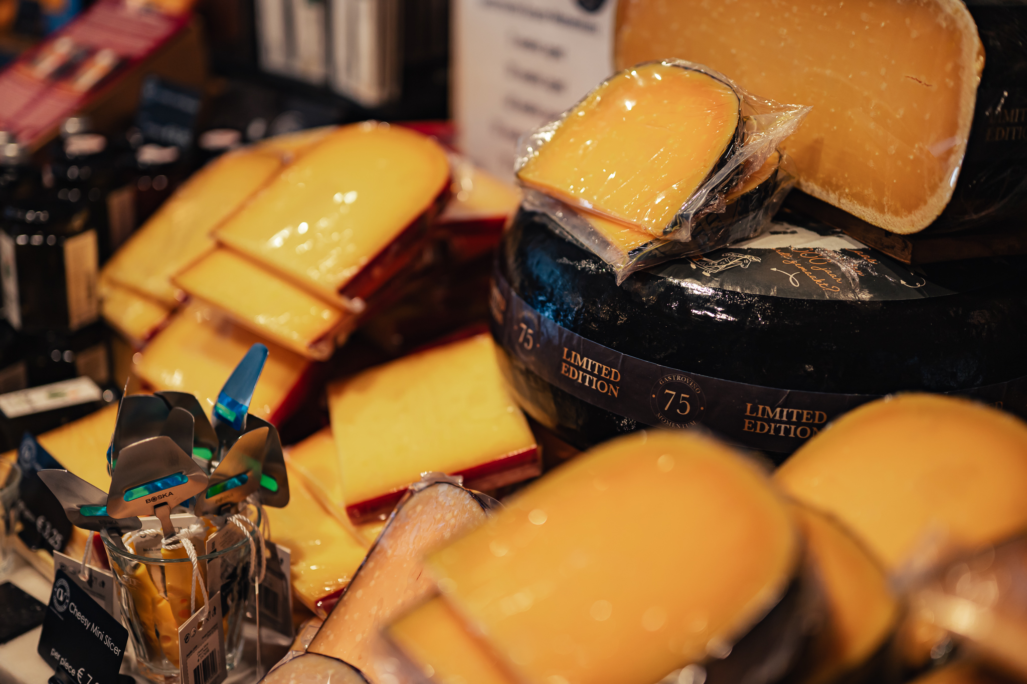 A variety of Dutch cheeses on a display. These can be seen on the food tour with Amsterdamliebe